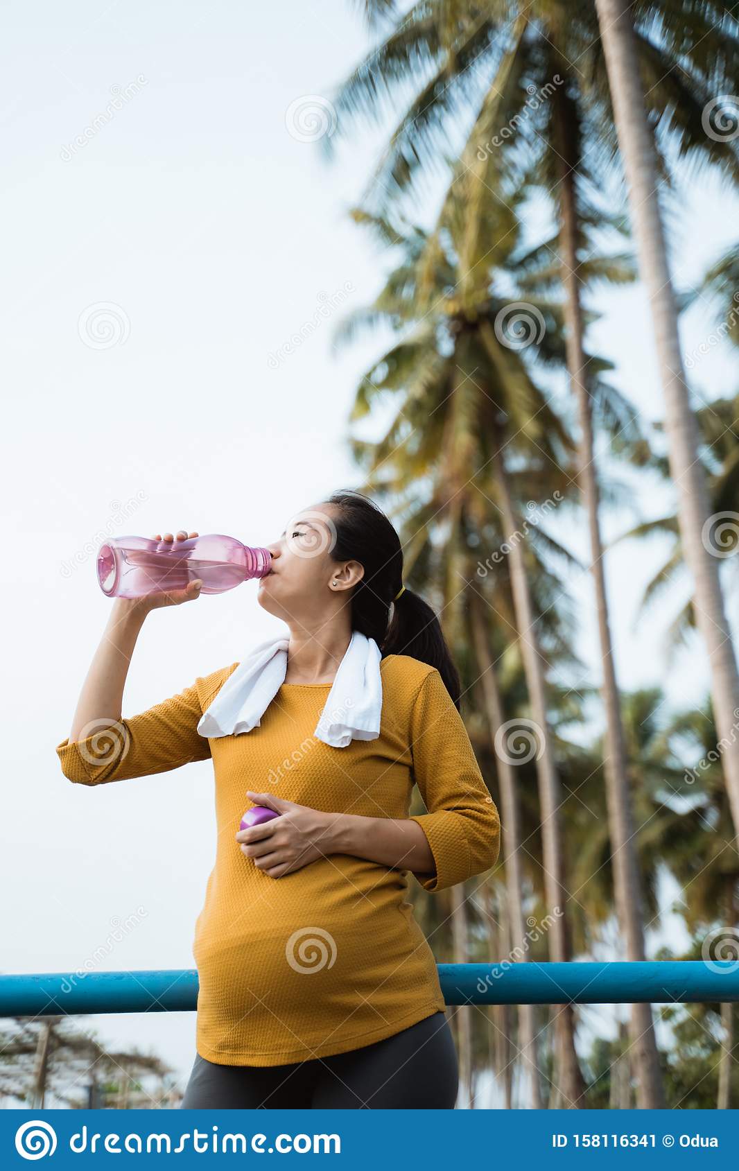 Pregnant Woman Drink Water Bottle While Workout Stock Image
