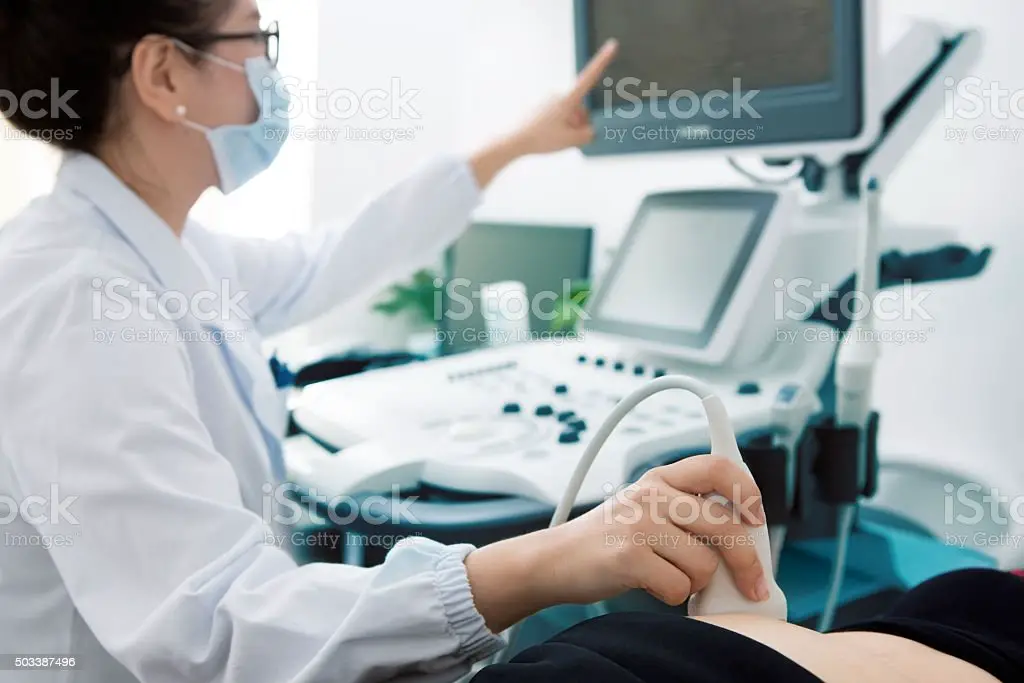 Pregnant Woman Having An Ultrasound Stock Photo