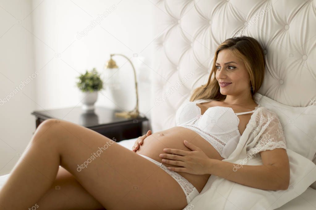 Pretty Young Pregnant Woman Laying Bed  Stock Photo ...