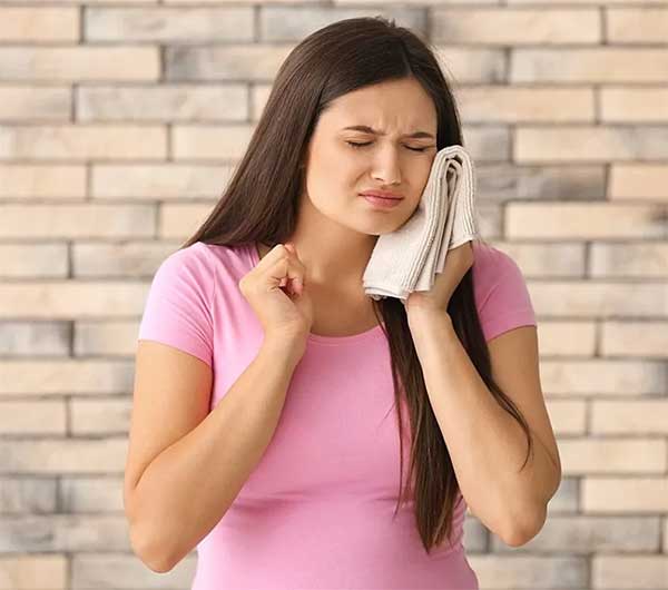 Unbearable Tooth Pain while Pregnant: Causes, Remedies